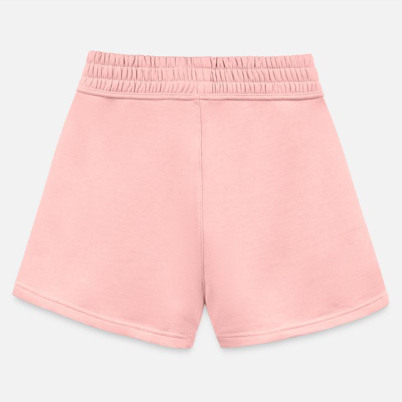 Black kitten with red nose hiding in a cup